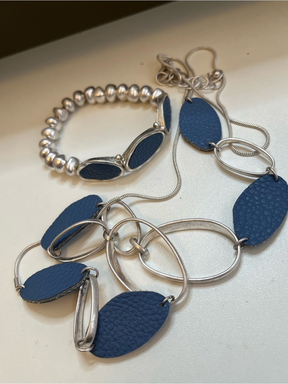 Blue leather silver tone modern necklace and bracelet set